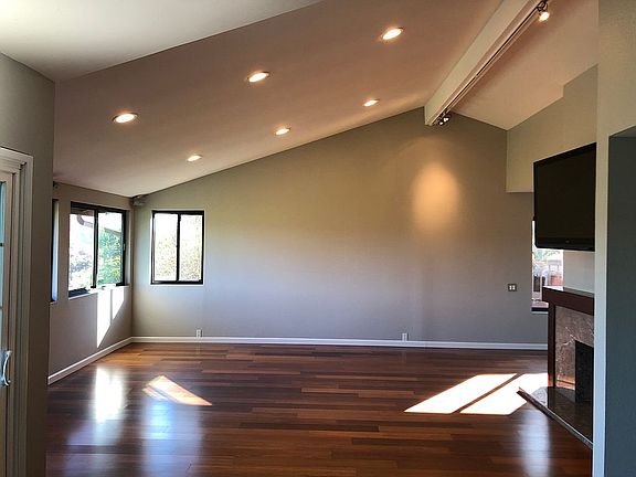 Standing in dining area.