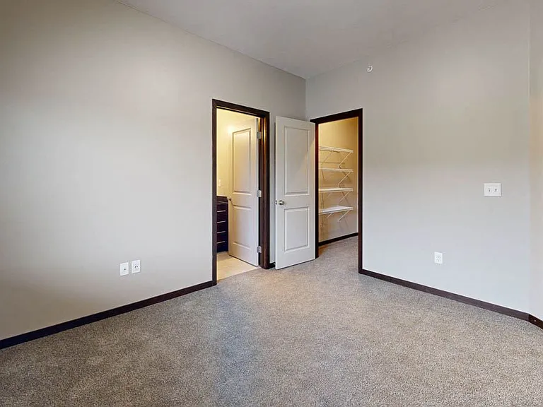Primary bedrooms feature an attached bathroom and a walk-in closet.