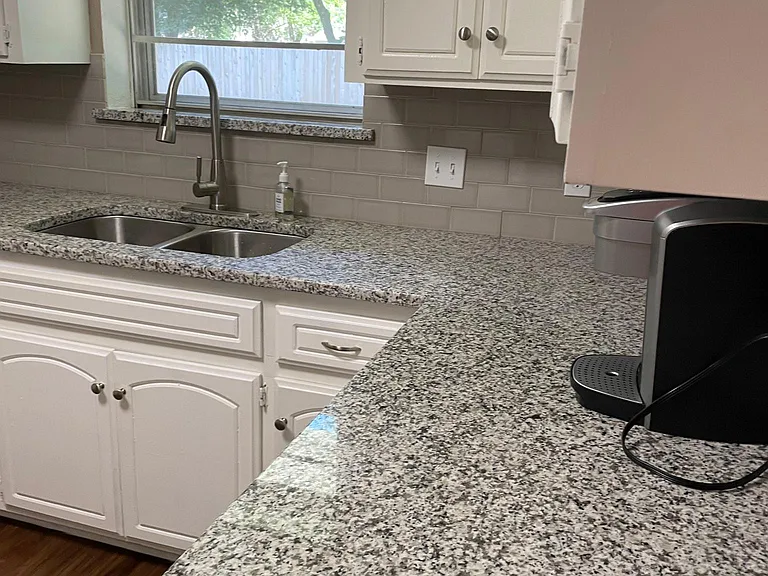 Kitchen with granite counters.