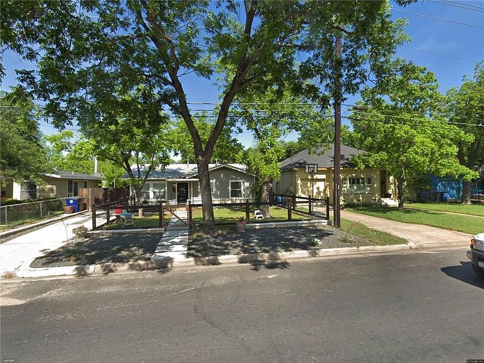 Front of house with fenced yard