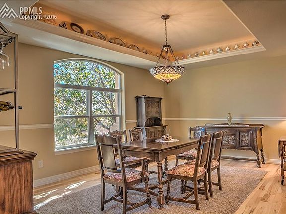 Formal dining room with lighted tray ceiling
