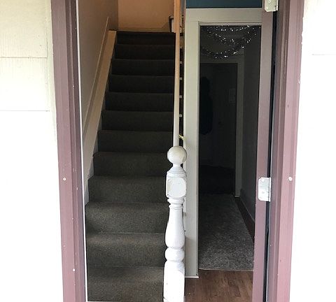 Stairs lead to apartment.