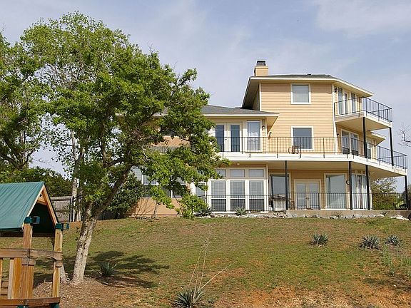 large backyard with 3 decks