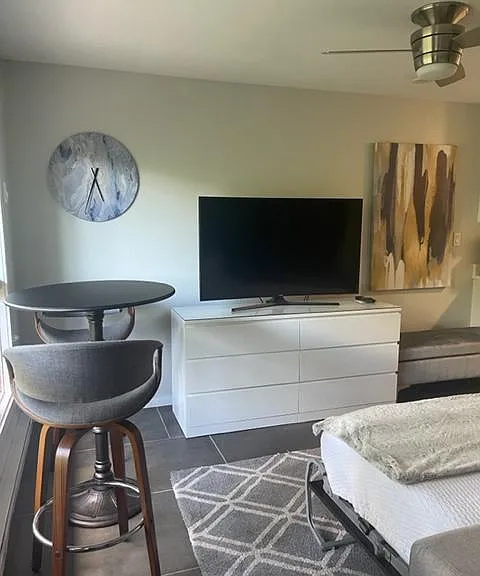 Large, six drawer dresser.
Curved screen TV. Bistro table overlooking the river.