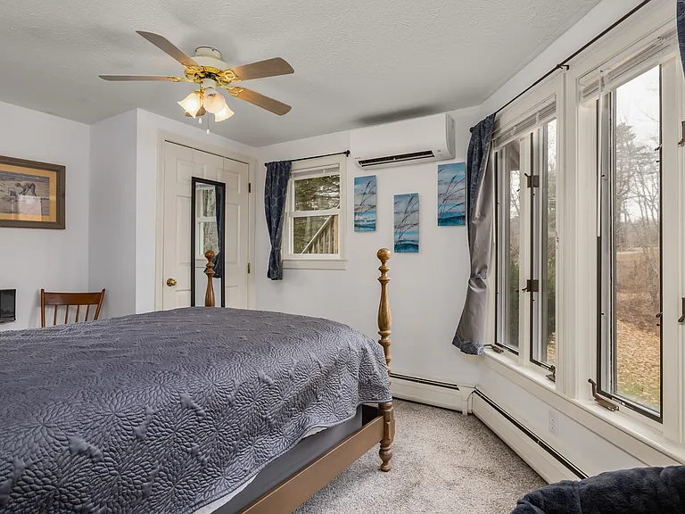 Bedroom 2 with full/double size bed and closet and view of backyard.