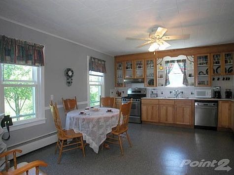 EAT-IN KITCHEN-TILE COUNTERS BACKSPLASH -STAINLESS STEEL APPLIANCES