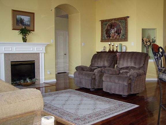 Brazilian wood floors, large-screen TV niche, push-button fireplace