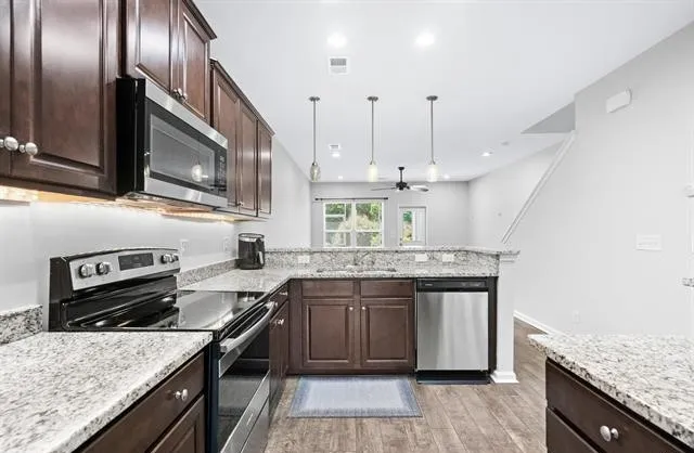 Solid surface countertops and stainless steel appliances - 489 Carnaby Loop