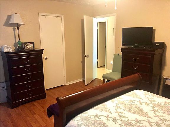 Master bedroom holds lots of furniture