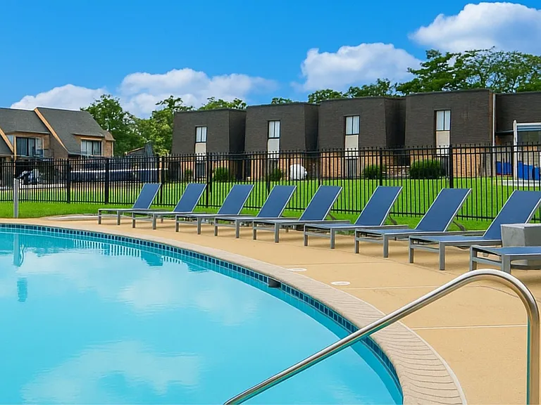 Unwind at The Crossings at Neshaminy Apartments, where modern living meets resort-style amenities. Enjoy our sparkling pool surrounded by lush greenery and comfortable seating. Schedule a tour today and see your new home!