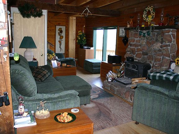 Living Room w wood stove & Peak views