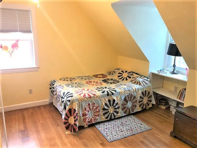 2nd bedroom upstairs is also roomy. Ceiling fan and built in bookcases.