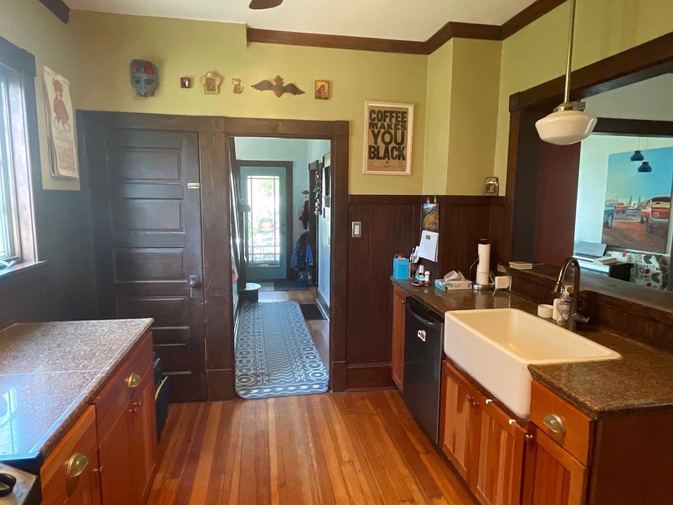 Kitchen with door to downstairs laundry and shop