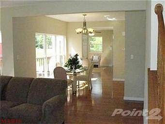 A view through the dining room, with the deck off the left.