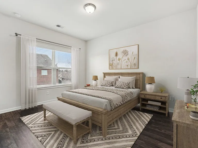 Secondary bedroom with queen size bed and large window letting in a ton of natural light.