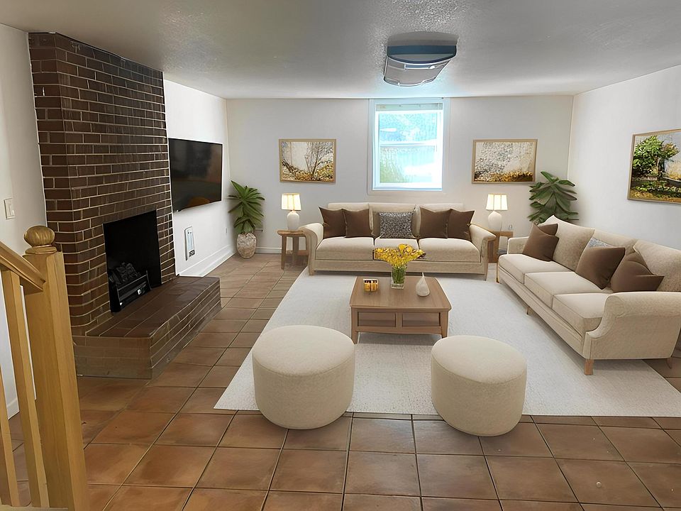 Large living room with fireplace, lots of natural light (virtually staged)