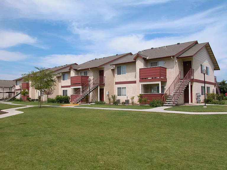Building Exterior View From Grass Area