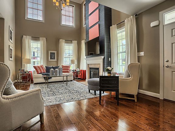 Living Room with two-story ceiling at Pickering Crossing