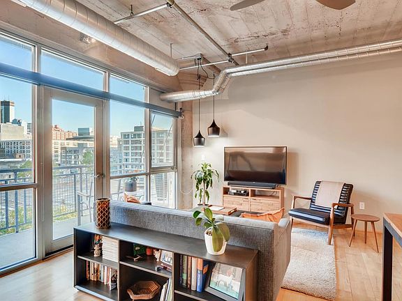 Stunning loft with a downtown view! Floor to ceiling windows provide tons of light.
