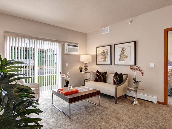 Baseboard heating and air conditioning create the perfect living room for all seasons