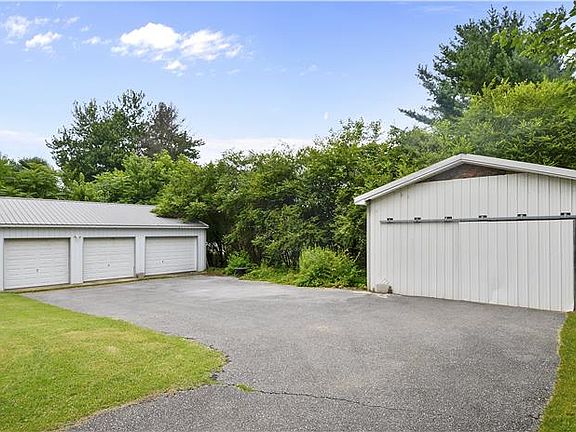 3 bay garage, a 2 level shed