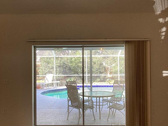 View from living room to outside pool area