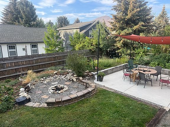 Outdoor fenced in yard with firepit and private yard