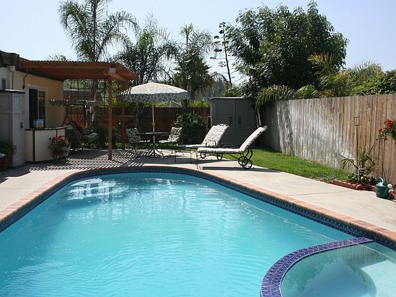 Enjoyable back yard with pool and spa