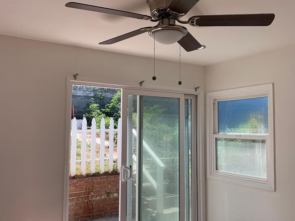 Bedroom with access to the back yard,with new can lights and fan