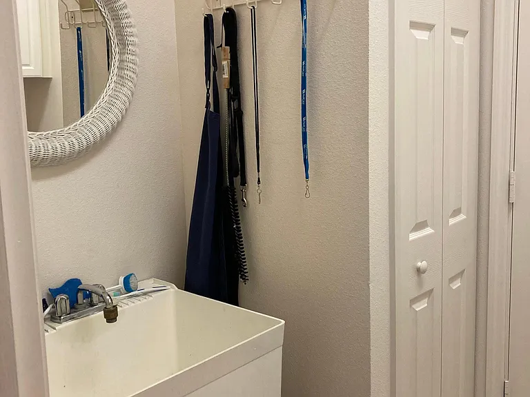 Laundry room. Has washer/dryer and laundry tub and pantry.