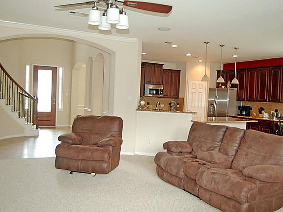 Large family room open to kitchen and breakfast room.  Corner gas fireplace.