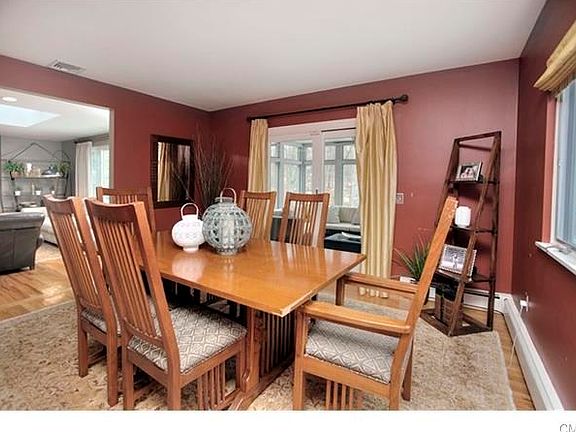 Formal dining room, with access to three season screened in porch.