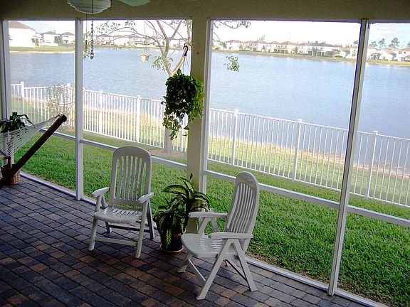 Covered screened patio overlooking 42 acre lake