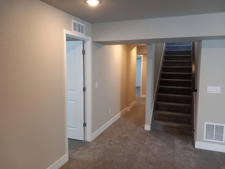 From Rec Room looking up stairs, bedrooms and bath on the left