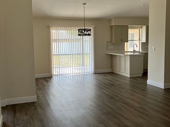Open Living/Dining Areas showing new laminate flooring