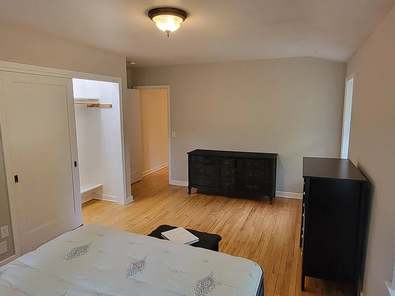 Master bedroom. Large room looking towards hall.