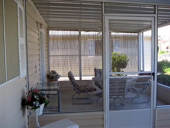 2 Screened in AZ Rooms! Watch all the excitement at the Club House or just walk across the street to join in the fun! No need for a golf cart here!