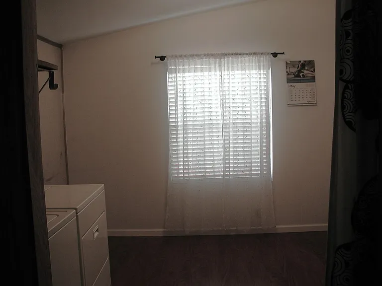 Laundry with bonus space and two closets
