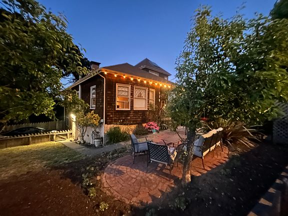 Front and side yard with pear, plum, lemon and apple trees