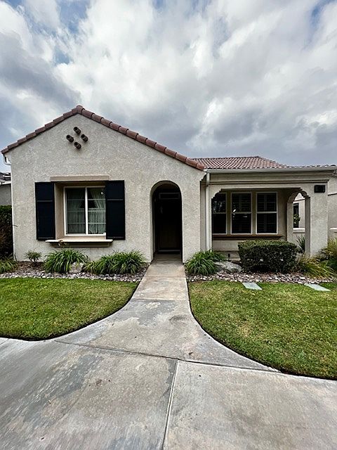 Front of house overlooks golf course.