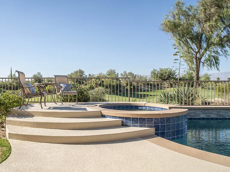 Updated pool decking, landscaping, lighting and dining patio make this the space you want to be in all the time.
