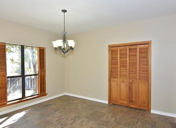 Spacious formal dining area with a nice sized closet for your serving pieces and China.