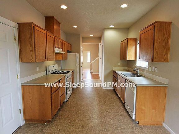 Separate Garage Door offers easy entrance to the Kitchen.