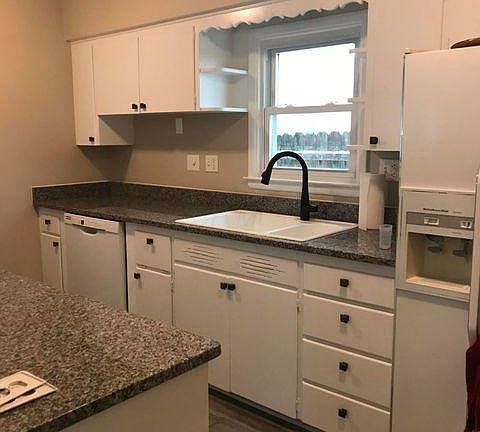 kitchen with granite counters, and updated appliances