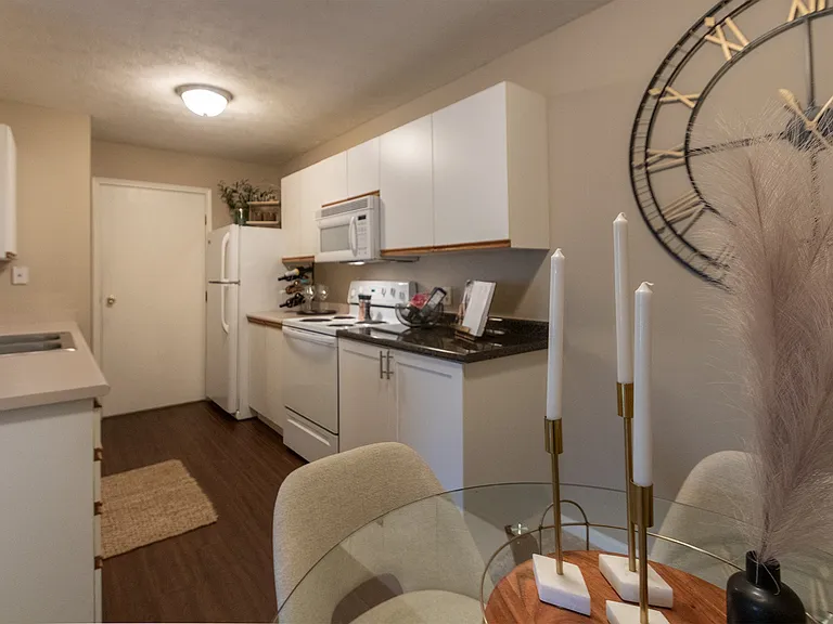 Our model Liberty kitchen features both upgraded cabinetry with dark countertops and classic cabinetry with light countertops.