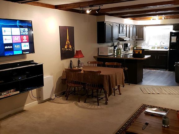 Newly painted cabinets and new kitchen flooring.