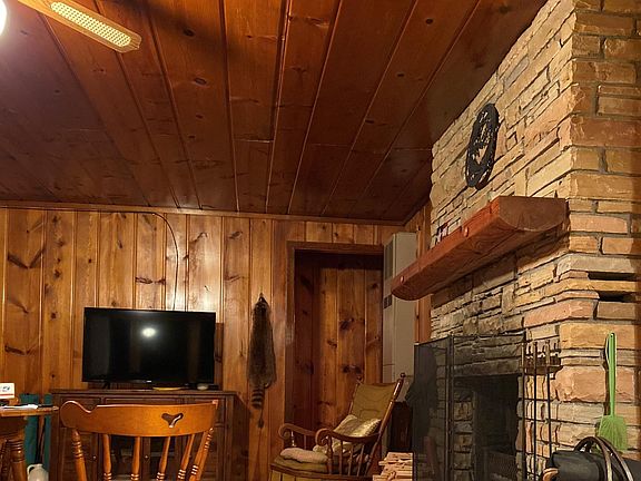 Original wide plank knotty pine throughout to provide a true "up North" feel and a warm, relaxing atmosphere.