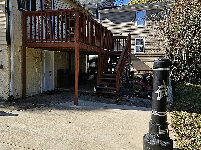 Entryway is under the back deck