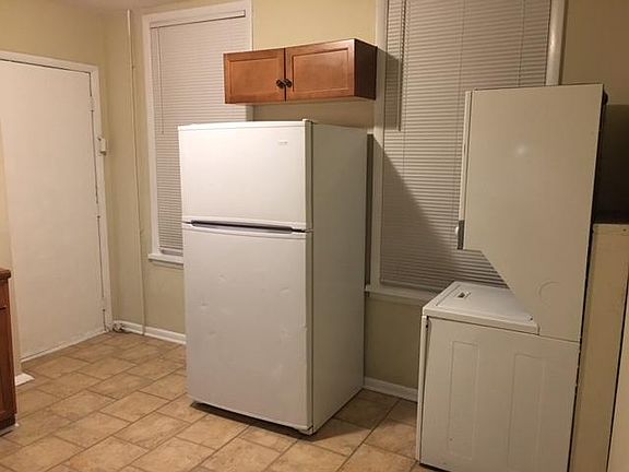 Large refrigerator and Stack-able washer and dryer included