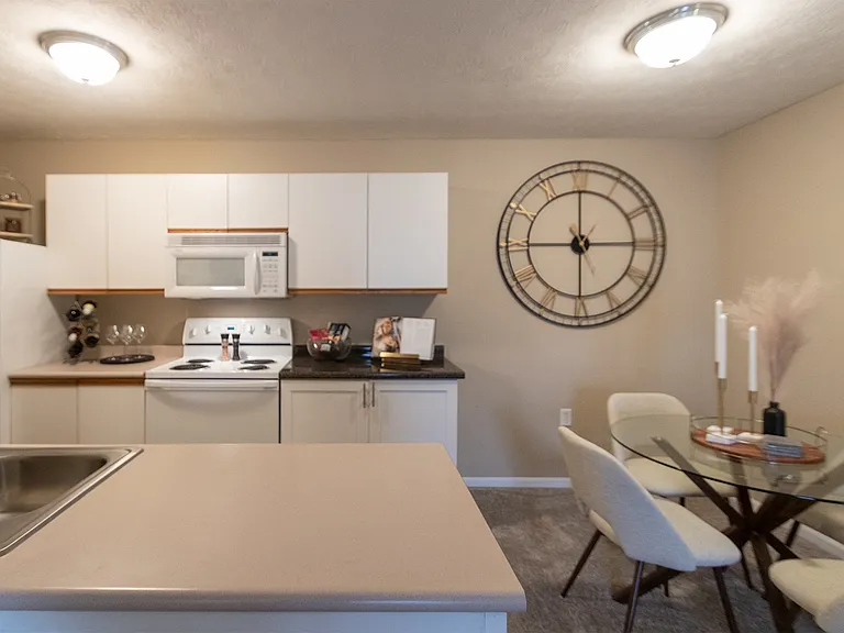 Our model Liberty kitchen features both upgraded cabinetry with dark countertops and classic cabinetry with light countertops.